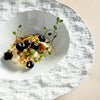white unique soup plate